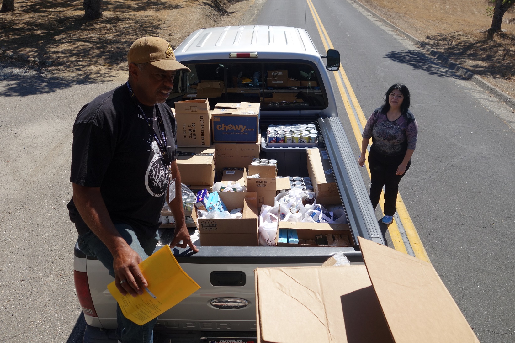 California Valley Miwok Tribal staff helps unloading good supplies.