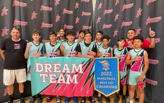 The Dream Team basketball team from California standing with their coaches after winning the 2022 basketball boys 14U California state championship