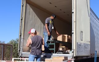 Tiger Paulk and Ronald Buckman unloading goods for the California Valley Miwok Tribe