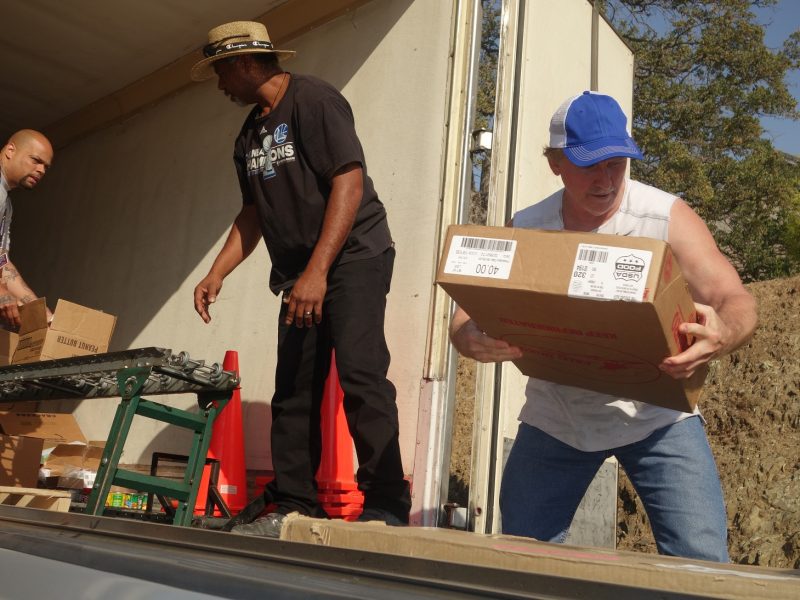 As Naz keeps it coming Ronald Buckman waits as tribal staff loads vehicle for those who needed their distributions picked up.