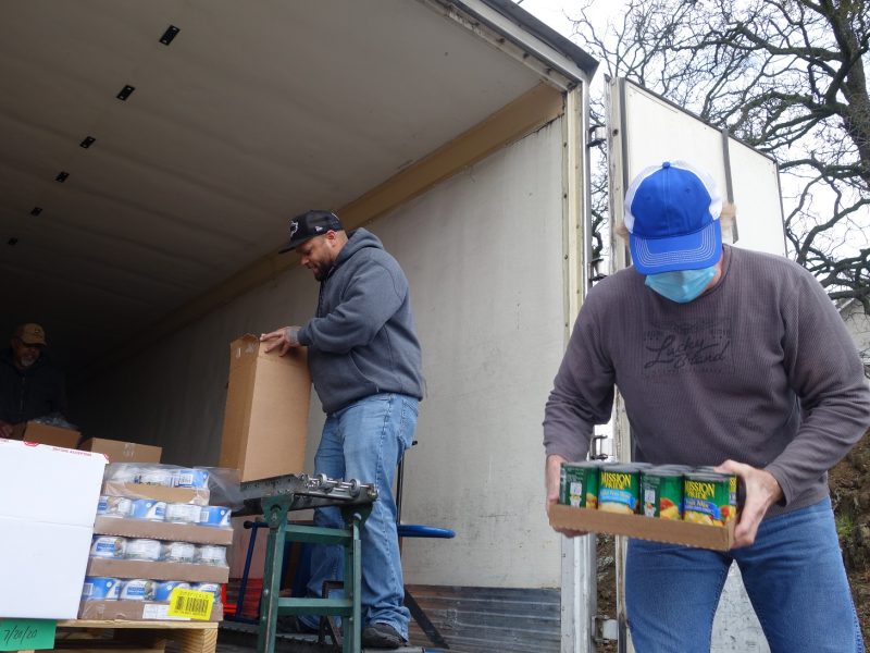 As Specialist Ronald Buckman completes the last distribution of the day, Specialist Naz rechecks contents, as tribal staff loads.
