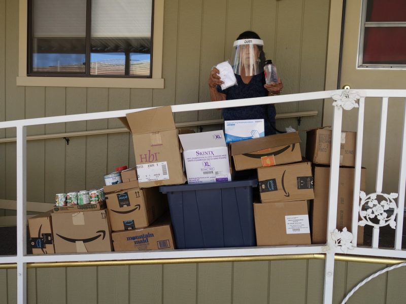 Program Director, Mildred Burley displays just some of the Covid-19 supplies that accompanied this month's distribution given by both FEMA and Cal OES. March 2021 Food For Tribal Families Distribution