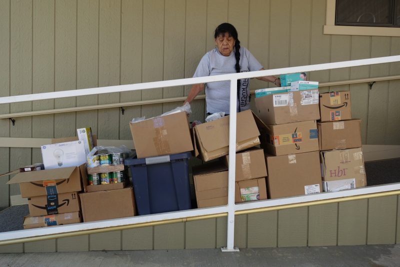 Food For Tribal Families, Program Director, Mildred Burley Stand's with this month's delivery.