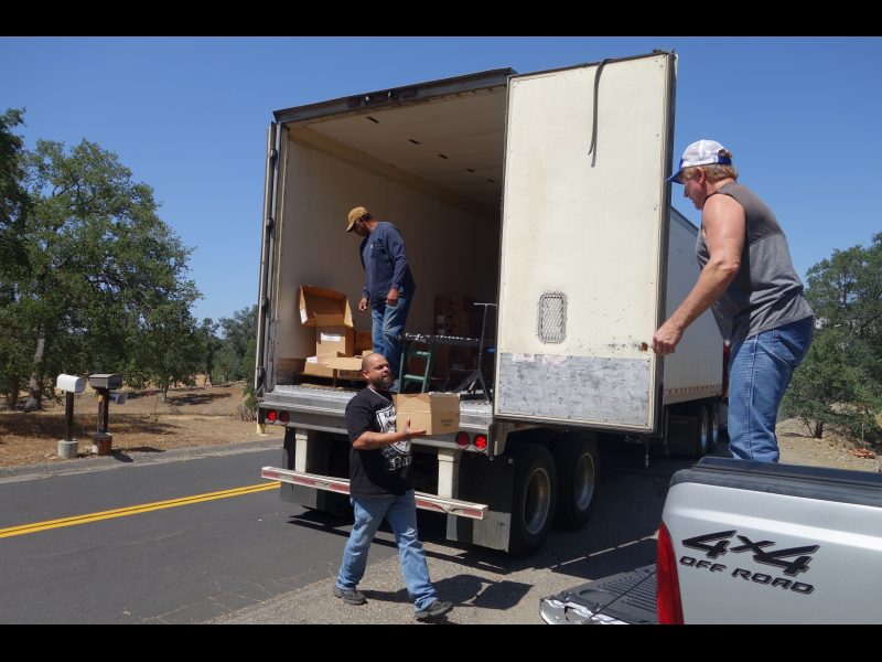 As Tule River Food specialist, ( Naz ) brings the last of the specific distributions that the tribe deliver's to those in need, specialist Ronald Buckman makes a last check before shutting doors. Tiger Paulk helps unloading good supplies with Tule River food distribution staff