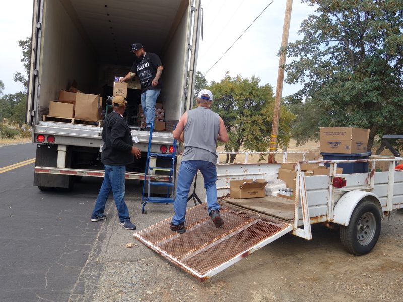 Finishing up last distribution under the tribal delivery program. Tribe recently purchased a freezer specifically to store perishables to avoid ongoing hardships and scheduling conflicts sometimes encountered within program. Tiger Paulk, Ronald Buckman and Naz are unloading good supplies for the California Valley Miwok Tribe.
