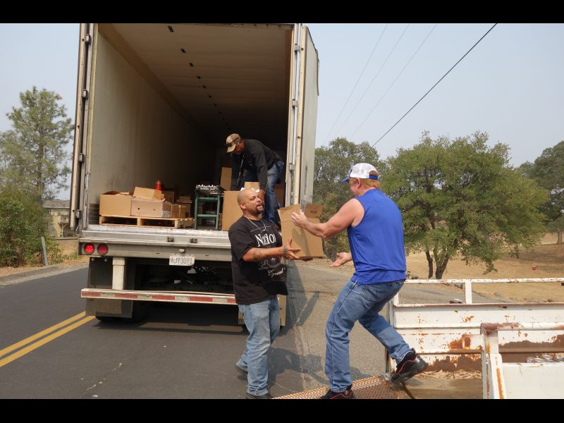 The last of another distribution between specialist Naz and tribal staff as Specialist Ronald Buckman starts preparing next distribution. Specialist Naz hands over good supplies box to California Valley Miwok Tribal staff Tiger Paulk.