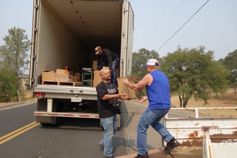 The last of another distribution between specialist Naz and tribal staff as Specialist Ronald Buckman starts preparing next distribution. Specialist Naz hands over good supplies box to California Valley Miwok Tribal staff Tiger Paulk.