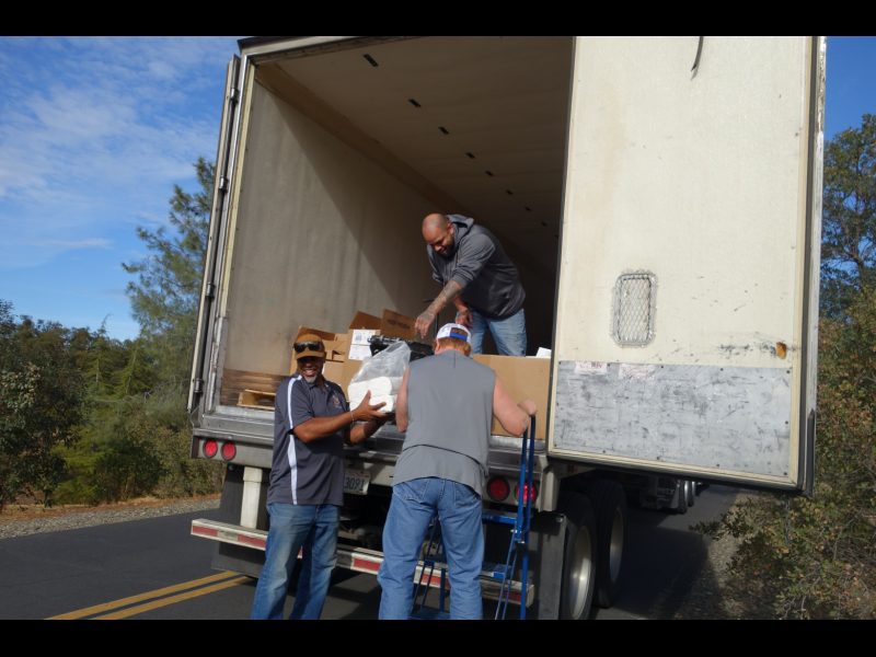 Specialists Ronald Buckman and Naz work with tribal staff during distributions. Tule River Food Distribution Specialists helping California Valley Miwok Tribal staff Tiger Paulk to unload good supplies.