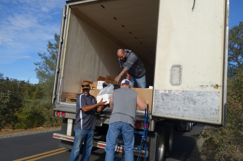 Specialists Ronald Buckman and Naz work with tribal staff during distributions. Tule River Food Distribution Specialists helping California Valley Miwok Tribal staff Tiger Paulk to unload good supplies.