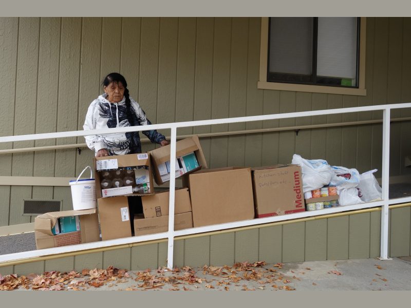 California Valley Miwok Tribal elder Mildred Burley with good supplies from the Food For Tribal Families program.