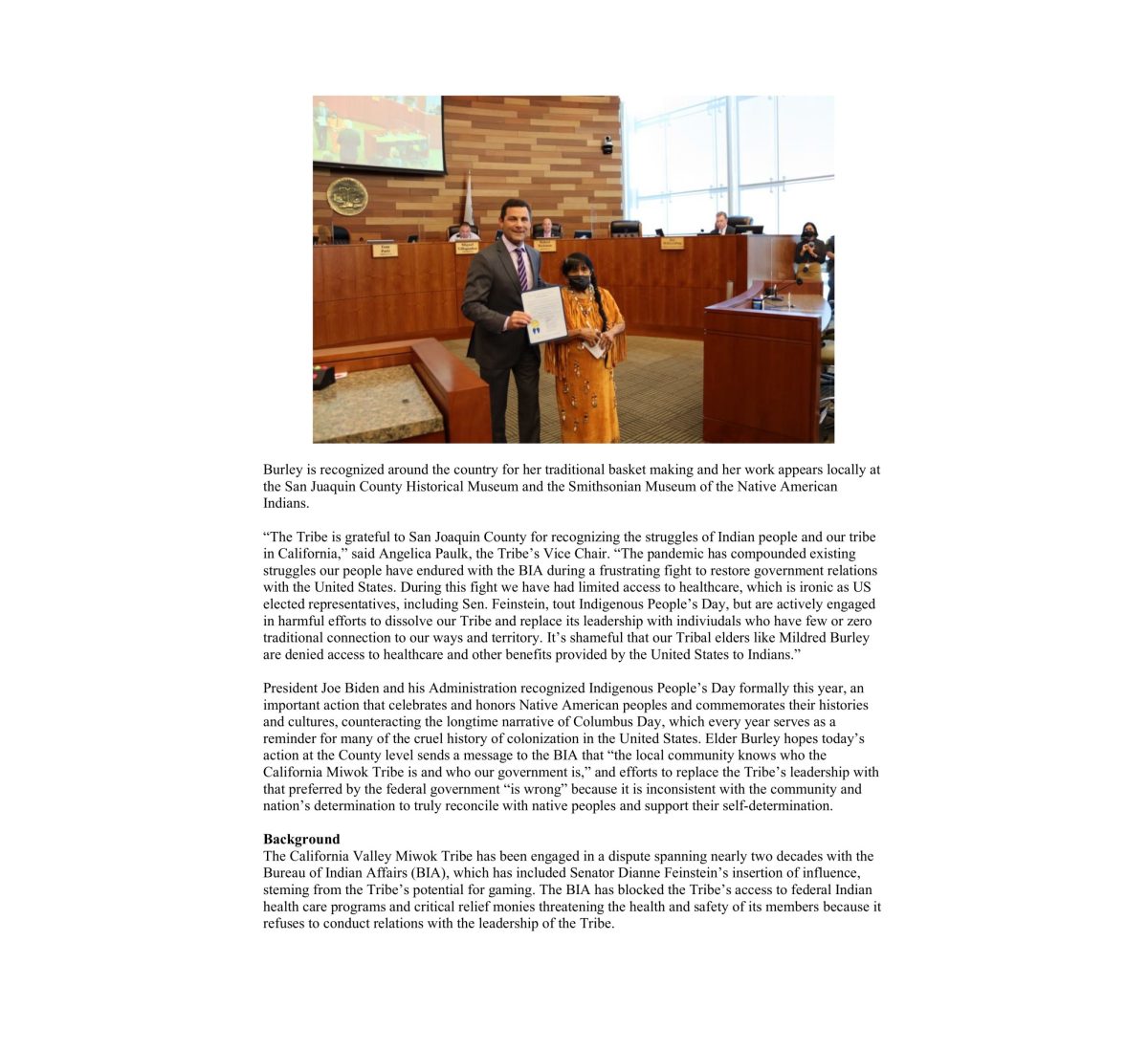 California Valley Miwok Tribal elder Mildred Burley with Tom Patti, holding the Indigenous Peoples’ Day proclamation.