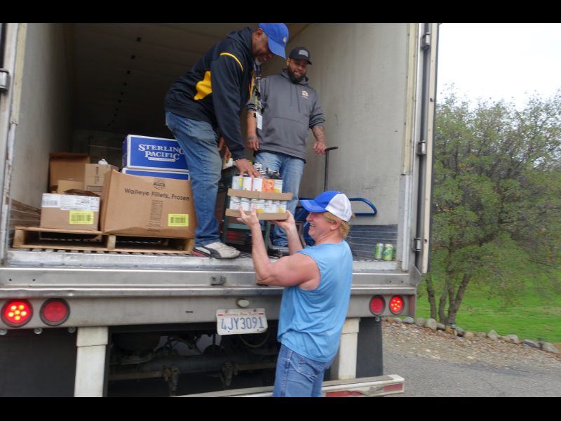 Towards the end of the last delivery, Specialist Naz came up from the back of loading the conveyor to get in on the humor as Specialist Ronald Buckman kept the comedy flowing till the end of the day's event. California Valley Miwok Tribe's staff unloading good supplies