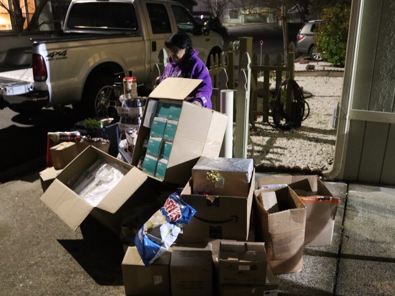 This picture shows how much was given through donations. We thank all of those who contributed to the health, welfare, safety and nutrition of our tribal peoples during this holiday season. Few in government realize the compassion of the American people. California Valley Miwok Tribe's elder Mildred Burley standing with supplies from Food for Tribal Families Program.