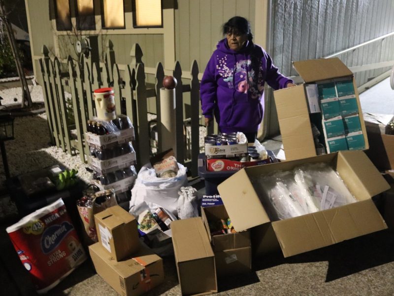 Additional picture was needed for this large distribution as there was so much compassion shown to
our people that they filled the hole in our hearts left by the Department of the Interior and specifically the Bureau of Indian Affairs. California Valley Miwok Tribe's elder Mildred Burley standing with supplies from Food for Tribal Families Program.