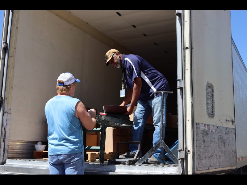 At the beginning of the event paperwork was being discussed over a new applicant that authorized the tribe to receive their food if they were unable to attend for personal delivery. This is a personal benefit made available by the tribe. California Valley Miwok's tribe Tiger Paulk and Ronald Buckman discussing about the food distribution program.