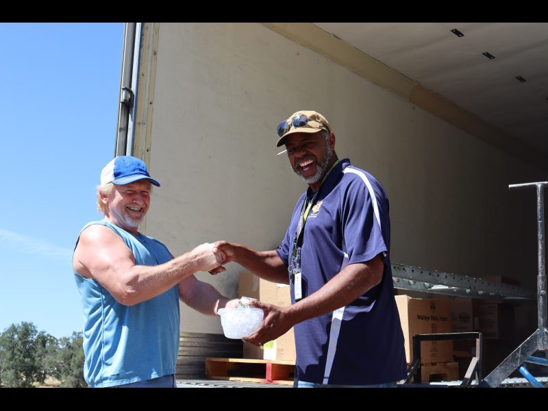 With the day over, tribal staff hands Specialist, "Ronald Buckman" an iced drink as is the tribe's custom never receive something without giving back and as we are the day's last stop, "Ron" can enjoy it on his journey back home. California Valley Miwok Tribe's Tiger Paulk handing Ronald Buckman an iced drink.