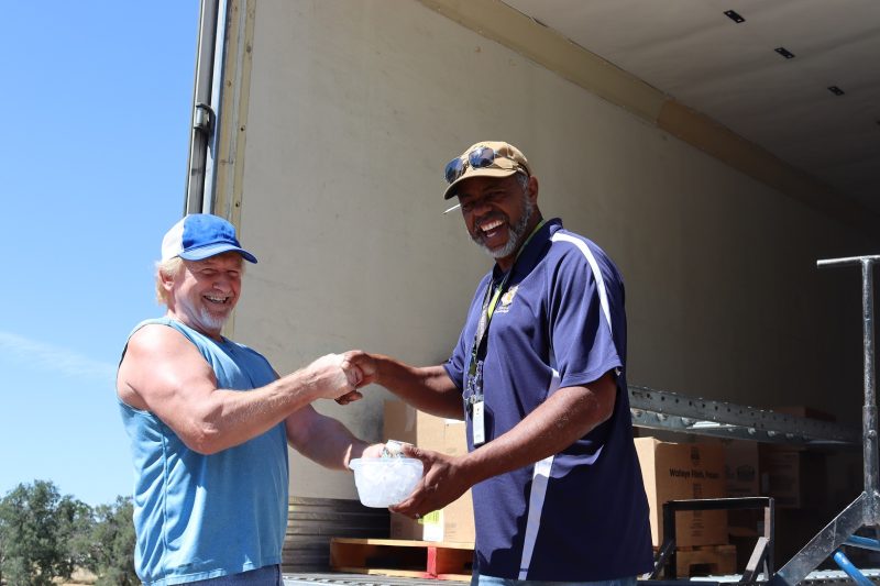 With the day over, tribal staff hands Specialist, "Ronald Buckman" an iced drink as is the tribe's custom never receive something without giving back and as we are the day's last stop, "Ron" can enjoy it on his journey back home. California Valley Miwok Tribe's Tiger Paulk handing Ronald Buckman an iced drink.