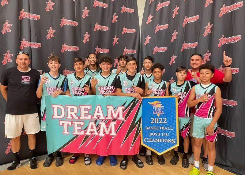 The Dream Team basketball team from California standing with their coaches after winning the 2022 basketball boys 14U California state championship