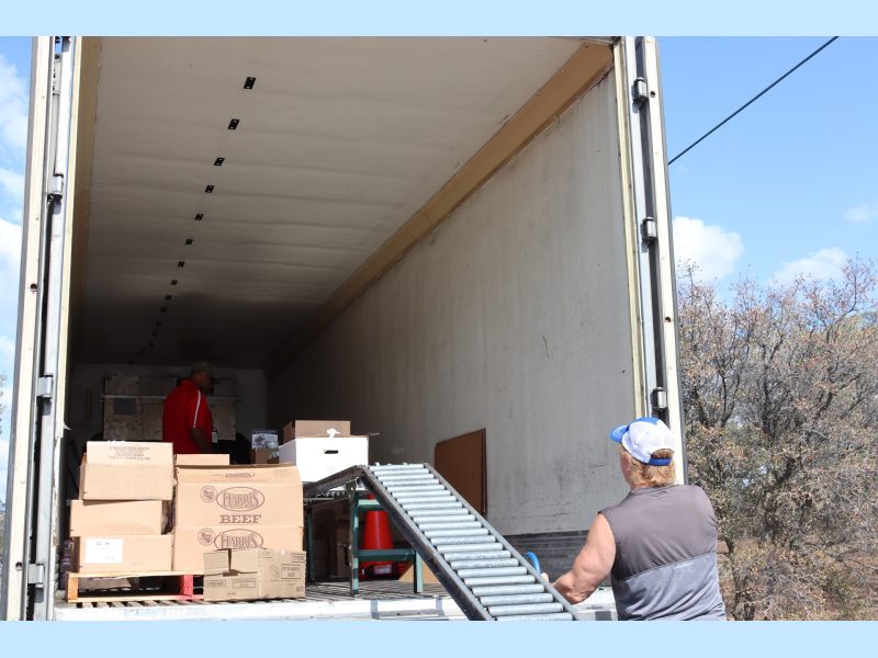 California Valley Miwok Tribe staff Tiger Paulk helps unloading goods.