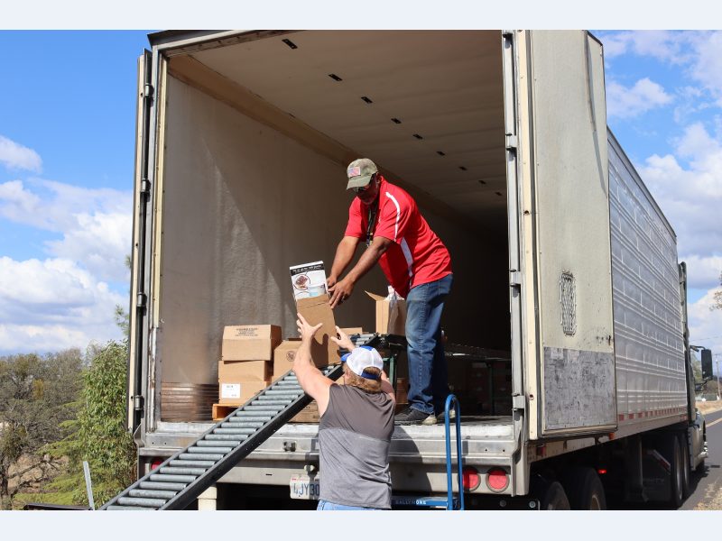 Ronald Buckman and Tiger Paulk are unloading goods for the California Valley Miwok Tribe.