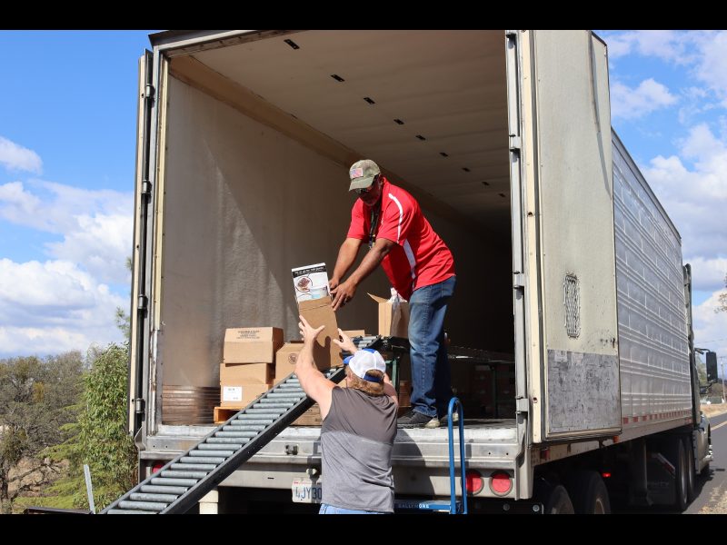 Specialist Ronald Buckman assists tribal staff with product for one of the day's recipients. Ronald Buckman and Tiger Paulk are unloading goods for the California Valley Miwok Tribe.