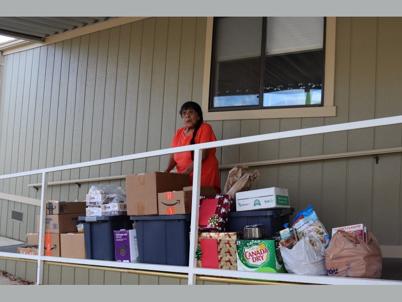 Mildred Burley with December 2022 food distribution.