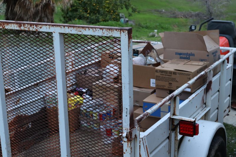 Picture displays foods that will additionally be personally delivered or held for pick up. Tribal goods in trailer.