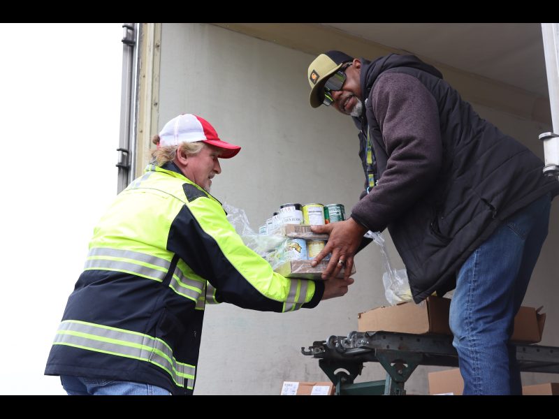 Specialist Ronald Buckman looks toward camera as he was getting ready to answer picture takers question. Ronald Buckman joking with Tiger Paulk.