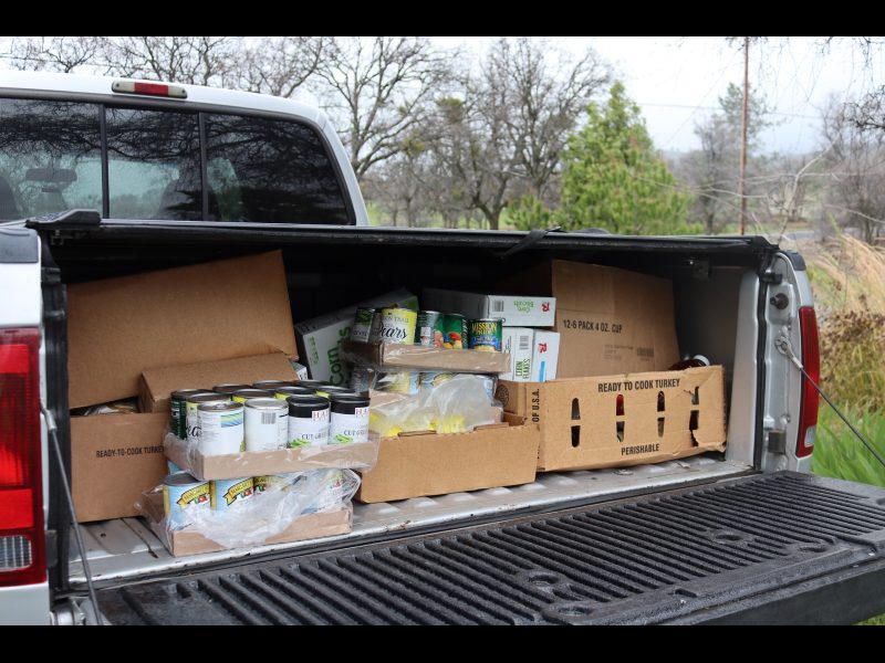 At the end of this day it was as much about keeping all food not picked up
dry as it was receiving. It was especially difficult sliding food forward as it completely filled an F250 bed. California Valley Miwok Tribe's food distribution in F250 trunk.