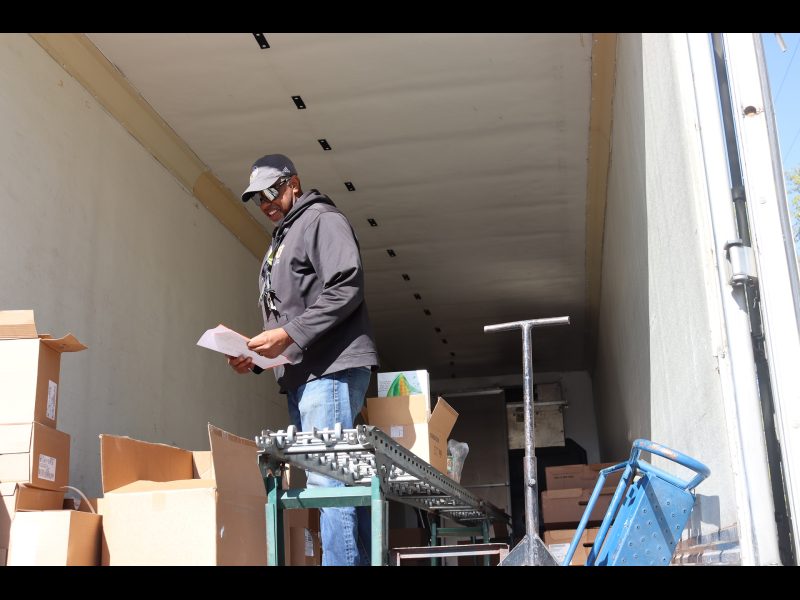 During distribution Specialist Ronald Buckman had some necessary paperwork for new attendee's to sign. Ronald Buckman taking care of paperwork for the California Valley Miwok Tribe during a goods distribution.