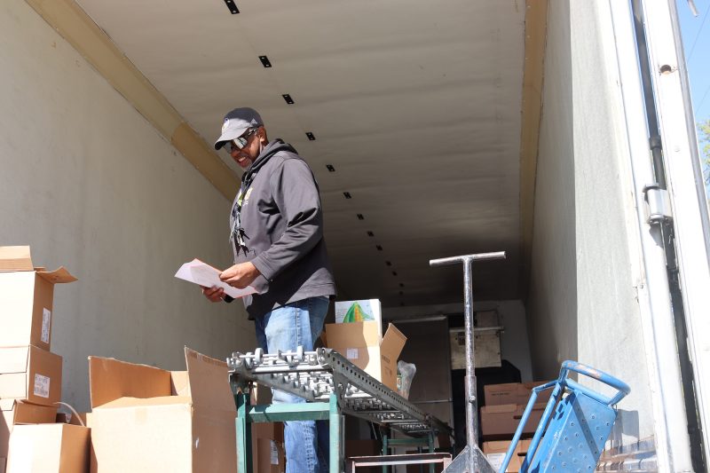 Ronald Buckman taking care of paperwork for the California Valley Miwok Tribe during a goods distribution.