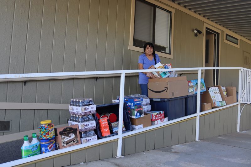 Mildred Burley standing in front of goods being delivered on April 16th, 2023.