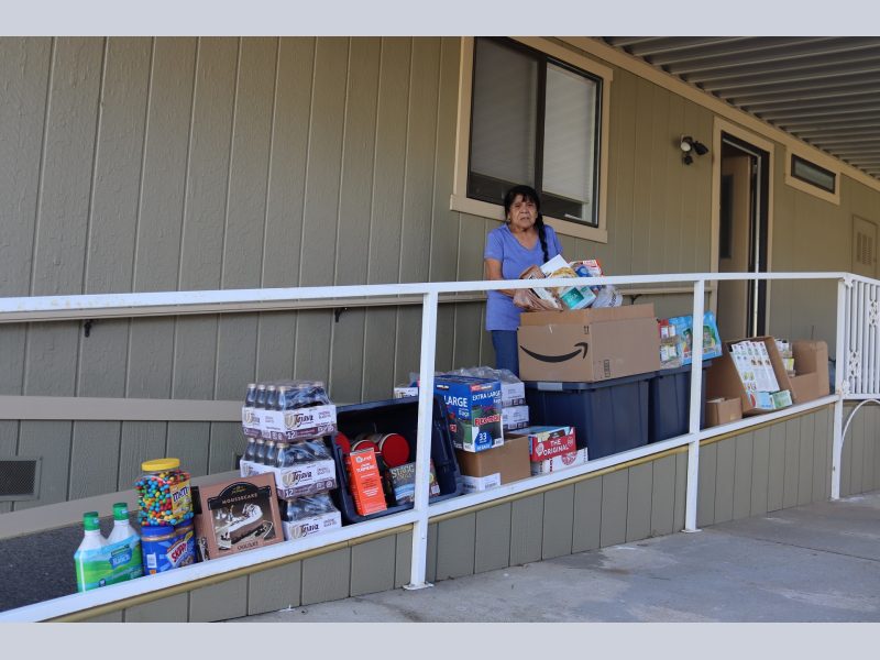 Program director Mildred Burley stands with the April 16th delivery that will benefit
California Valley Miwok Tribal Citizen's and their families. Mildred Burley standing in front of goods being delivered on April 16th, 2023.