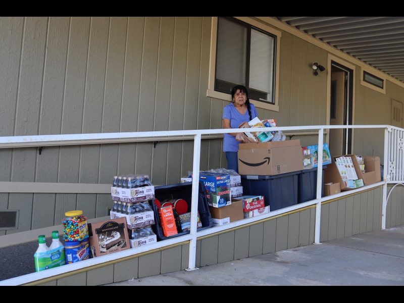 Program director Mildred Burley stands with the April 16th delivery that will benefit
California Valley Miwok Tribal Citizen's and their families. Mildred Burley standing in front of goods being delivered on April 16th, 2023.