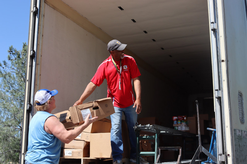 A good time is always had when everyone works together to provide
a service that will help native families. Tiger Paulk and Ronald Buckman smiling while delivering goods to California Valley Miwok Tribe.