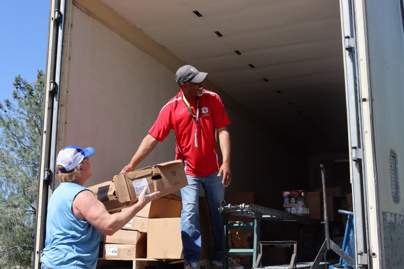 A good time is always had when everyone works together to provide
a service that will help native families. Tiger Paulk and Ronald Buckman smiling while delivering goods to California Valley Miwok Tribe.
