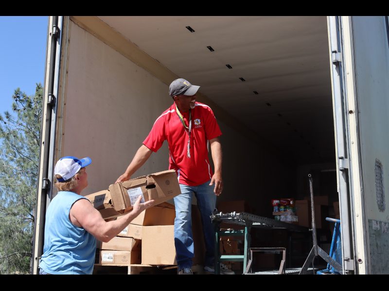 A good time is always had when everyone works together to provide
a service that will help native families. Tiger Paulk and Ronald Buckman smiling while delivering goods to California Valley Miwok Tribe.