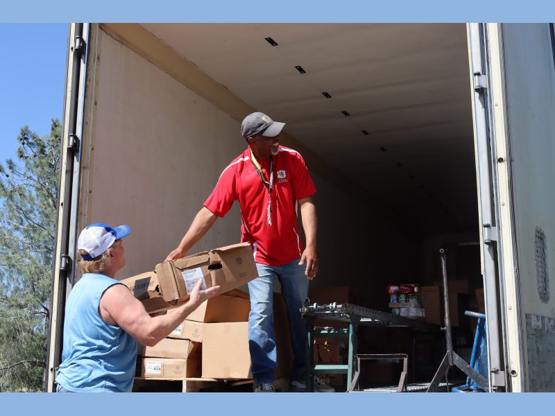 A good time is always had when everyone works together to provide
a service that will help native families. Tiger Paulk and Ronald Buckman smiling while delivering goods to California Valley Miwok Tribe.