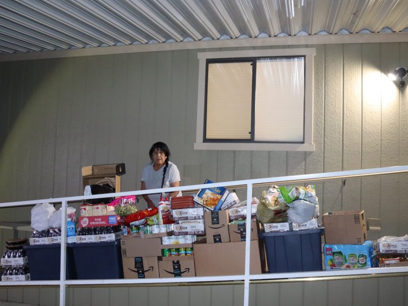 Another angle of just how much was received during the May Food For Tribal Families Program. Tribal elder Mildred Burley standing in front of goods being delivered to the Miwok tribe.