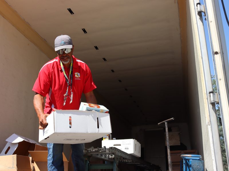 Tule River Food Specialist Ronald Buckman Finishing up one family's
distribution. Tule River Food Specialist Ronald Buckman
