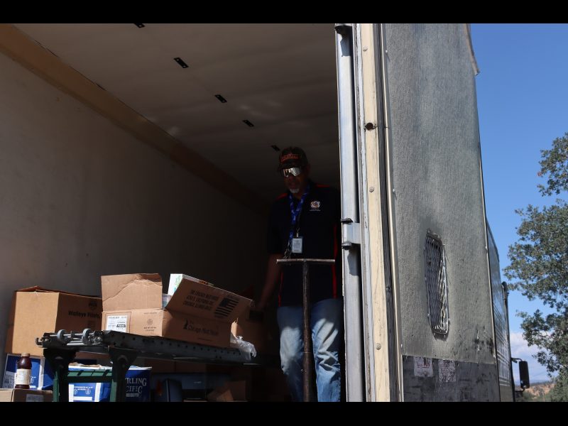 Here specialist Ronald Buckman is rolling out another distribution, looking just too cool. Tiger and Ronald Buckman unloading a truck of goods for Miwok tribal members.