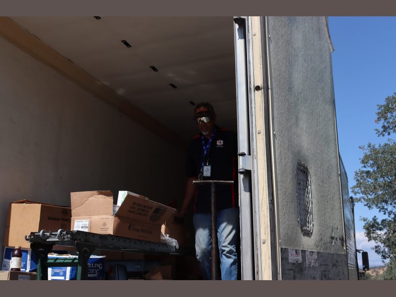 Here specialist Ronald Buckman is rolling out another distribution, looking just too cool. Tiger and Ronald Buckman unloading a truck of goods for Miwok tribal members.