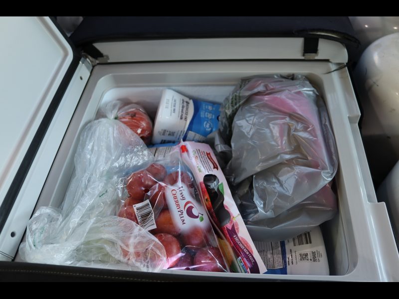 Just some of the items at the top of a very full refrigerated compartment. Food items for Miwok tribe members.