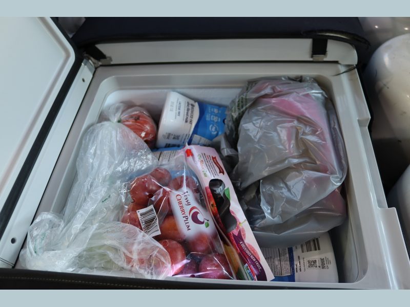 Just some of the items at the top of a very full refrigerated compartment. Food items for Miwok tribe members.