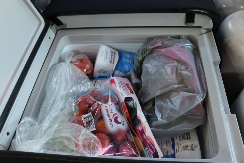 Just some of the items at the top of a very full refrigerated compartment. Food items for Miwok tribe members.