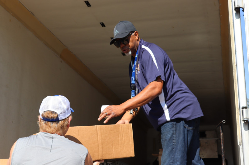 The end of one recipients distribution as Ronald Buckman readies to add more
to the conveyor for the next one. Ronald buckman handling the food distribution in September 2023.