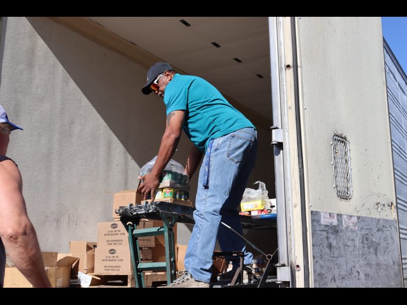 Service Provider Ronald Buckman getting ready to hand items to tribal staff. Ronald Buckman unloading goods for the California Valley Miwok Tribe, on October 2023.