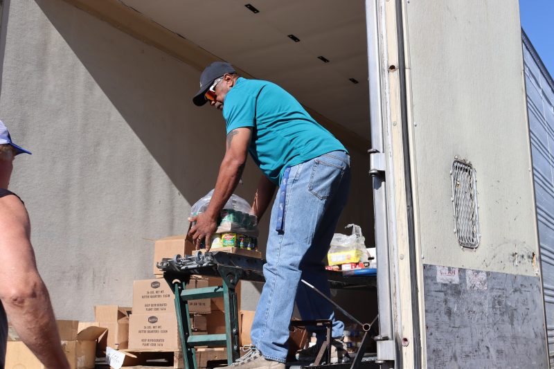 Service Provider Ronald Buckman getting ready to hand items to tribal staff. Ronald Buckman unloading goods for the California Valley Miwok Tribe, on October 2023.