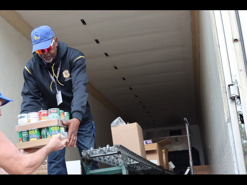 Tule River Food Distribution Department Specialist Ronald Buckman working with tribal staff during one of the events many distributions. Ronald Buckman and Tiger Paulk helping with distributions of goods for the Miwok Tribe.