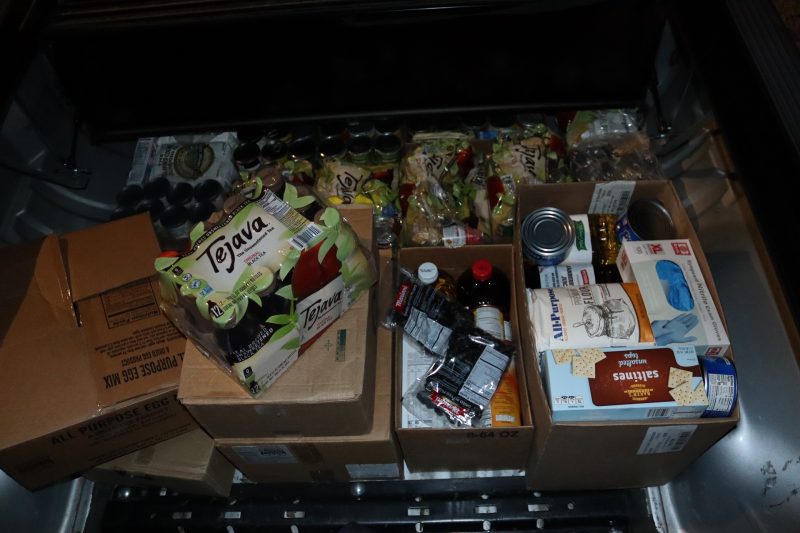 Various items boxed and exposed. Various boxes of foods to be delivered to Miwok Natives.